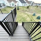Deck stairs with black railing